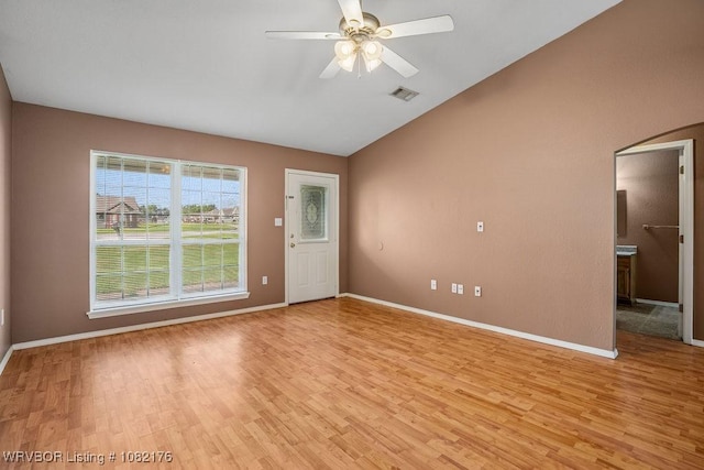 3707 Princeton Ct, Van Buren, AR 72956 - spare room with light wood-style floors, arched walkways, vaulted ceiling, and ceiling fan