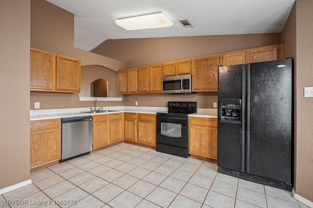 3707 Princeton Ct, Van Buren, AR 72956 - kitchen featuring black appliances, lofted ceiling, light countertops, and light tile patterned floors