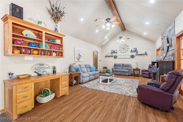 living area featuring recessed lighting, a ceiling fan, beam ceiling, arched walkways, and wood finished floors