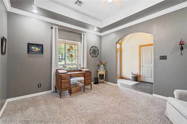 office featuring visible vents, arched walkways, ornamental molding, ceiling fan, and carpet flooring