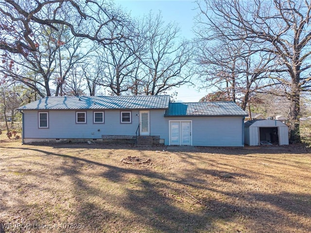 ranch-style house with a shed and a front lawn