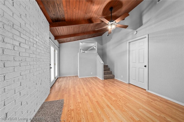 unfurnished living room with brick wall, light wood-type flooring, ceiling fan, wooden ceiling, and beam ceiling