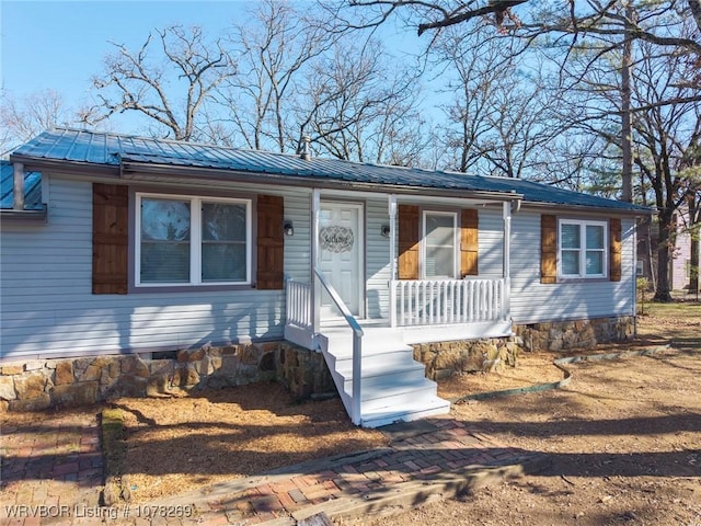 single story home featuring covered porch