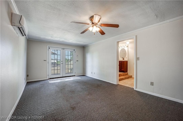 carpeted spare room with a wall unit AC, ceiling fan, french doors, and ornamental molding