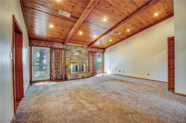 unfurnished living room with a healthy amount of sunlight, wooden ceiling, and a fireplace