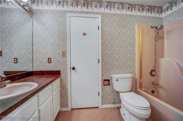 full bathroom featuring tile patterned flooring, vanity, toilet, and tub / shower combination