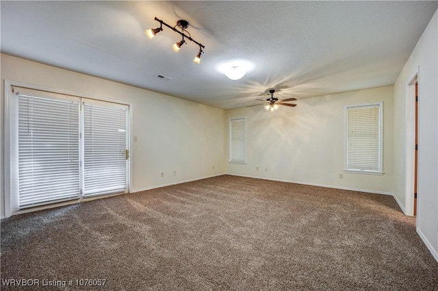 empty room featuring carpet and ceiling fan