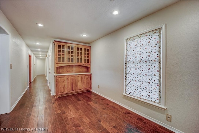 unfurnished dining area with dark hardwood / wood-style flooring