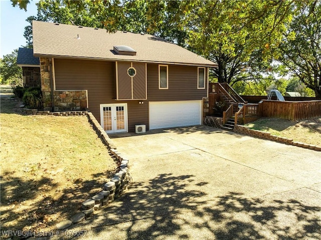 view of front of house featuring french doors and a garage