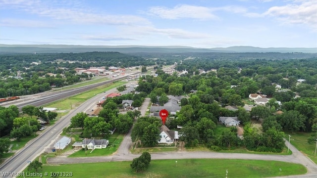 birds eye view of property with a mountain view