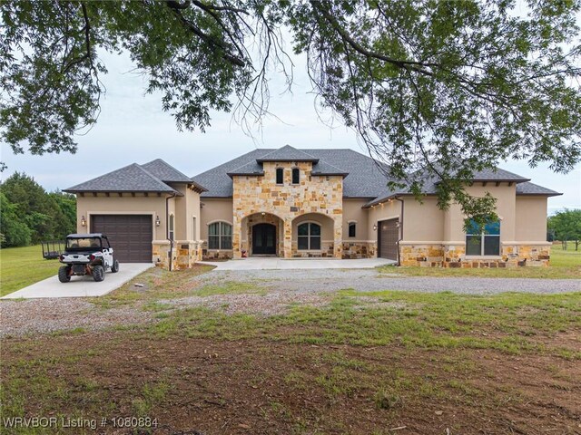 15454 Gap Creek Rd, Poteau, OK 74953 - french country home featuring stone siding, an attached garage, and stucco siding