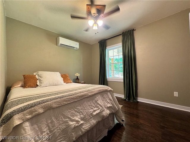 469497 975th Rd, Sallisaw, OK 74955 - bedroom featuring a wall mounted air conditioner, dark wood-style floors, baseboards, and ceiling fan