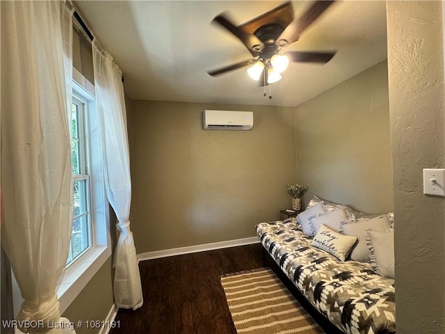 469497 975th Rd, Sallisaw, OK 74955 - living area with a wall mounted air conditioner, wood finished floors, baseboards, and ceiling fan