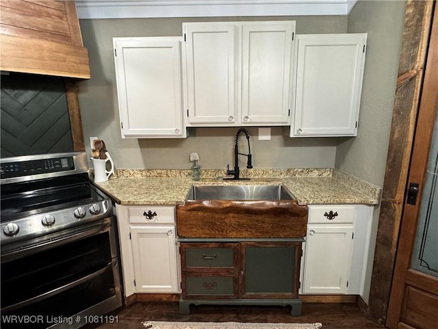 469497 975th Rd, Sallisaw, OK 74955 - kitchen featuring double oven range, white cabinetry, a sink, and light stone counters