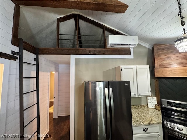 469497 975th Rd, Sallisaw, OK 74955 - kitchen featuring freestanding refrigerator, an AC wall unit, dark wood finished floors, white cabinets, and light stone countertops