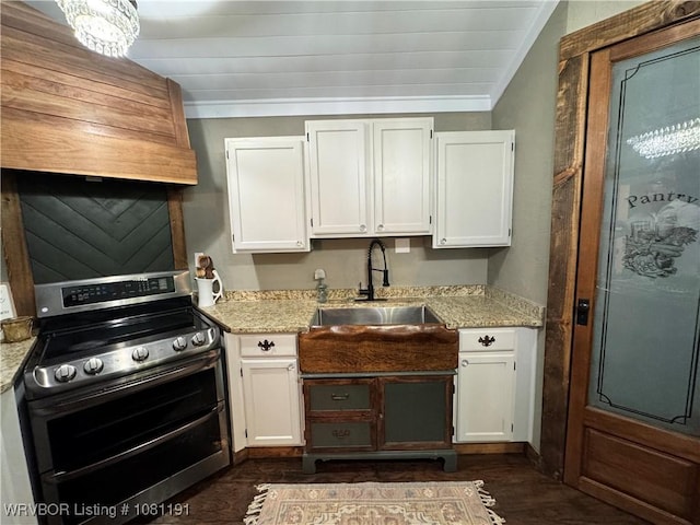 469497 975th Rd, Sallisaw, OK 74955 - kitchen with range with two ovens, a sink, white cabinets, and light stone counters