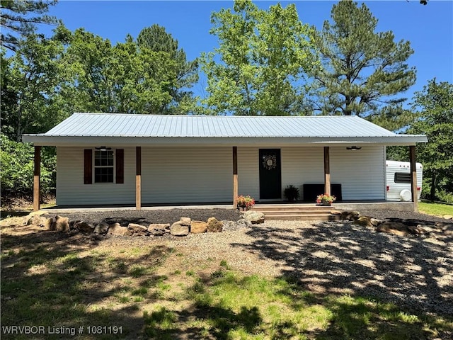 469497 975th Rd, Sallisaw, OK 74955 - view of front of house featuring a porch and metal roof