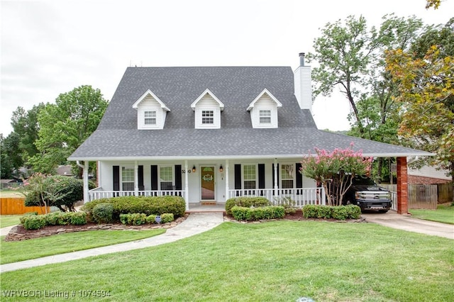 view of front facade featuring a front yard and a carport