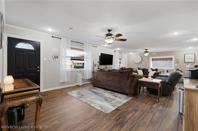 living room featuring visible vents, baseboards, ornamental molding, recessed lighting, and dark wood-style floors