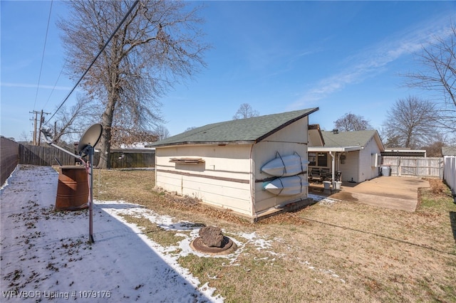 view of side of property with a gate and a fenced backyard