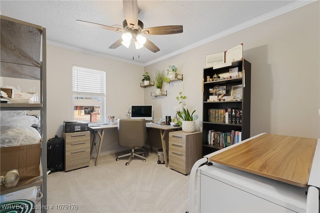 home office featuring light carpet, a textured ceiling, ceiling fan, and ornamental molding