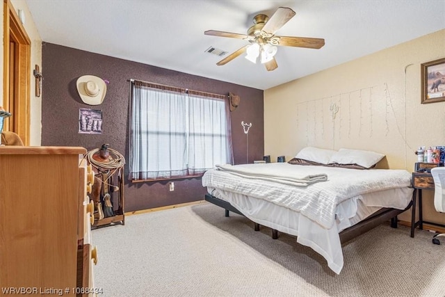 bedroom with ceiling fan and carpet floors