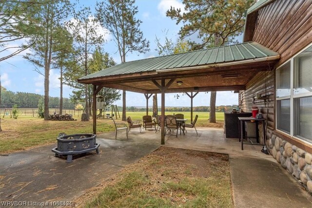 view of patio / terrace with a gazebo and an outdoor fire pit