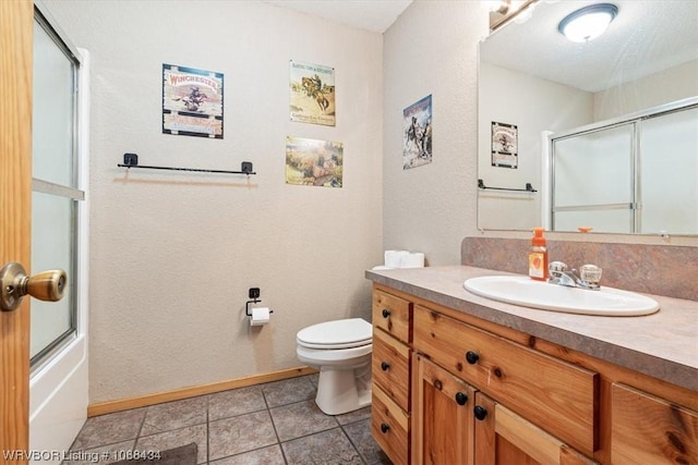 full bathroom with tile patterned floors, a textured ceiling, vanity, shower / bath combination with glass door, and toilet