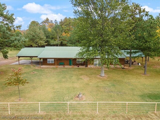 view of front of home featuring a rural view and a front yard