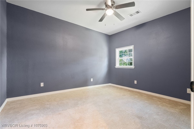 unfurnished room with light carpet and ceiling fan