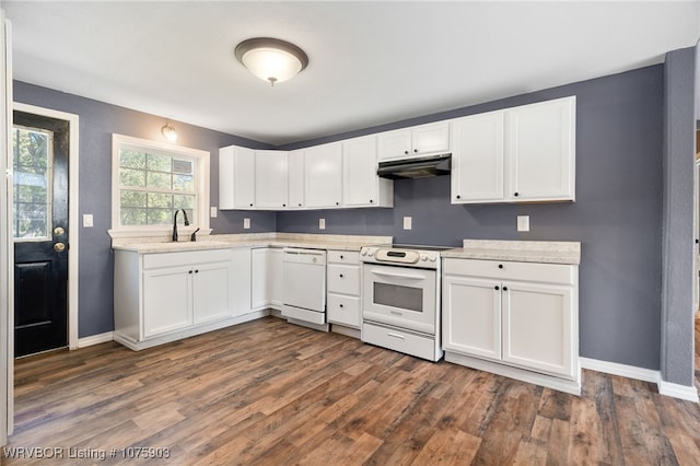 kitchen with white appliances, white cabinetry, dark wood-type flooring, and sink