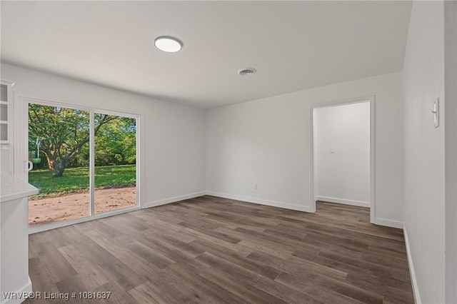 123 Oak St, Alma, AR 72921 - empty room featuring wood finished floors
