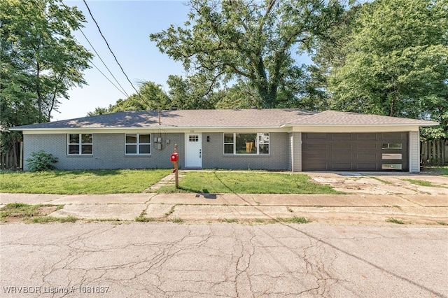 123 Oak St, Alma, AR 72921 - view of front of home featuring a garage, driveway, and brick siding