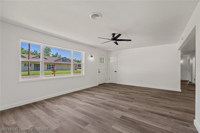 123 Oak St, Alma, AR 72921 - unfurnished living room featuring a ceiling fan and wood finished floors