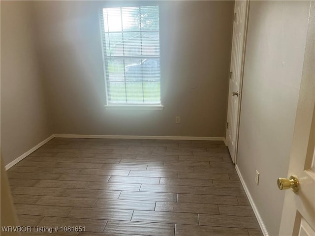 1505 6th Ter, Barling, AR 72923 - unfurnished room with wood finished floors and baseboards