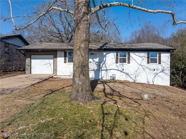 view of front of home with a garage and a front yard