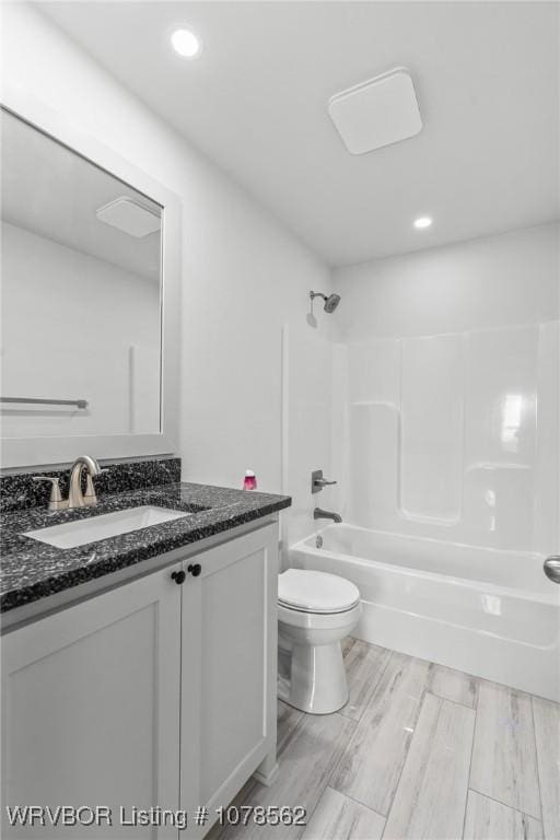 full bathroom featuring vanity, toilet, and shower / bathtub combination