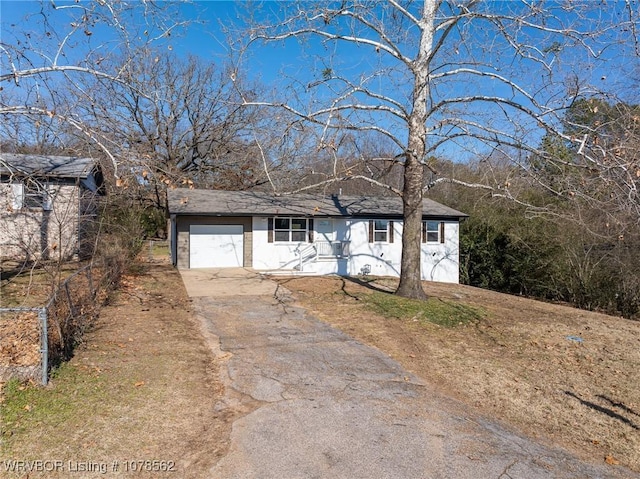 single story home featuring a garage