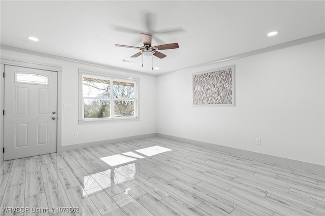 foyer entrance featuring ceiling fan, light hardwood / wood-style flooring, and ornamental molding