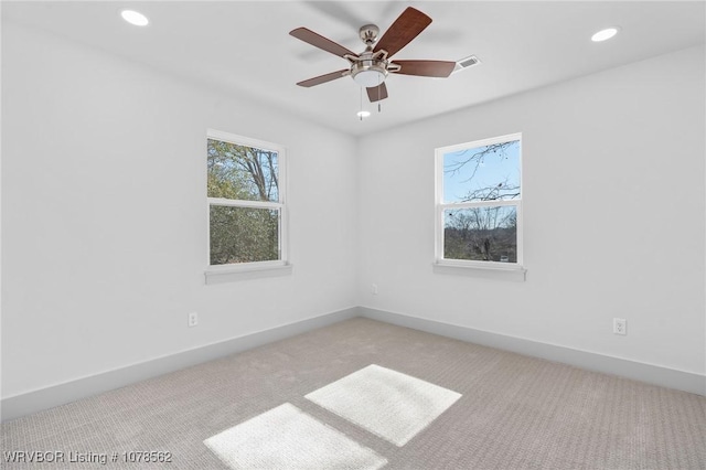 carpeted empty room with ceiling fan