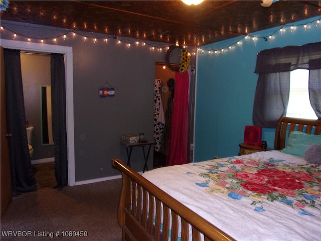 carpeted bedroom with baseboards