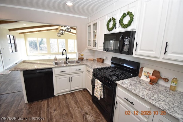 kitchen with a peninsula, a sink, black appliances, glass insert cabinets, and white cabinetry