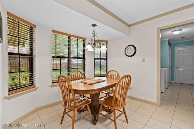 2508 Roxbury Ln, Fort Smith, AR 72908 - dining room featuring light tile patterned floors, crown molding, a chandelier, washer and clothes dryer, and a textured ceiling