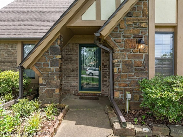 2508 Roxbury Ln, Fort Smith, AR 72908 - property entrance featuring stone siding, brick siding, and roof with shingles