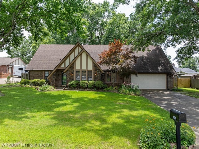 2508 Roxbury Ln, Fort Smith, AR 72908 - tudor home with driveway, stone siding, an attached garage, and roof with shingles