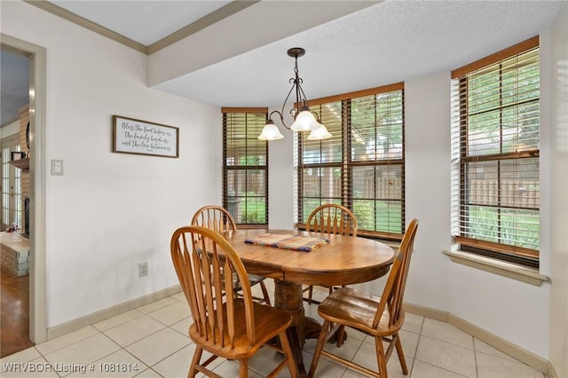 2508 Roxbury Ln, Fort Smith, AR 72908 - dining area with a chandelier, light tile patterned floors, and ornamental molding