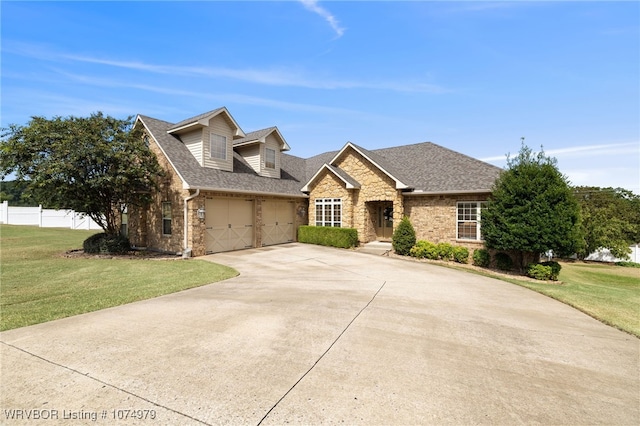 view of front facade with a garage and a front lawn