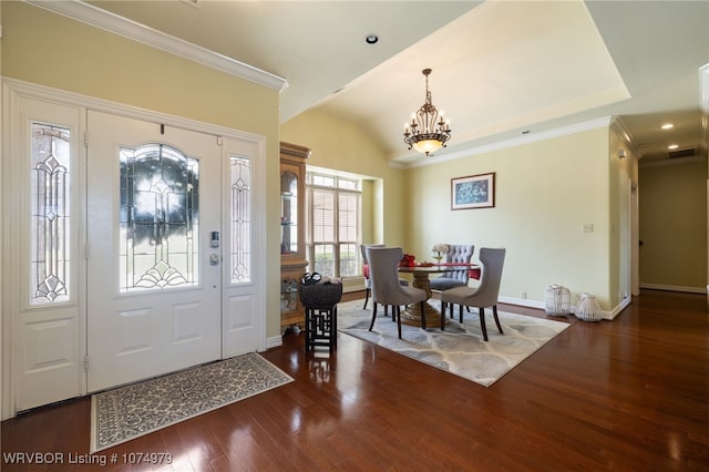 foyer featuring dark hardwood / wood-style flooring and a notable chandelier