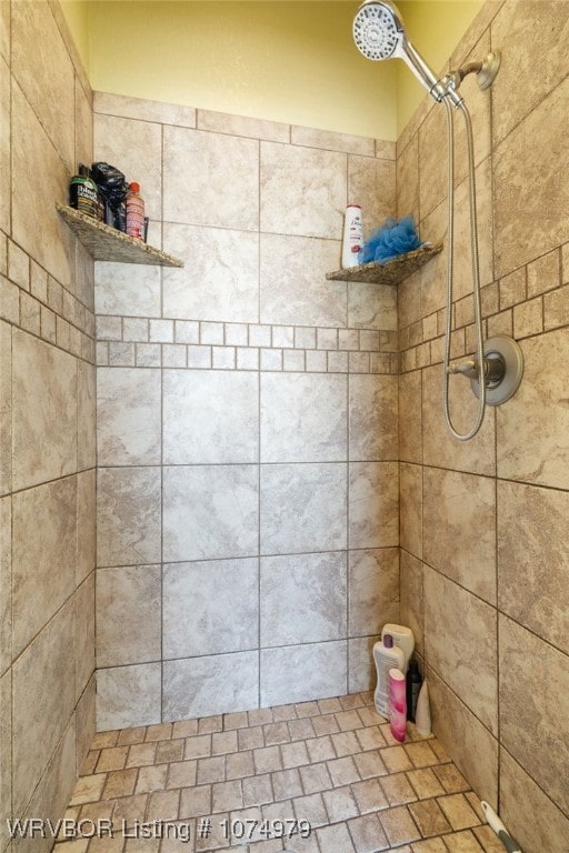 bathroom with tiled shower