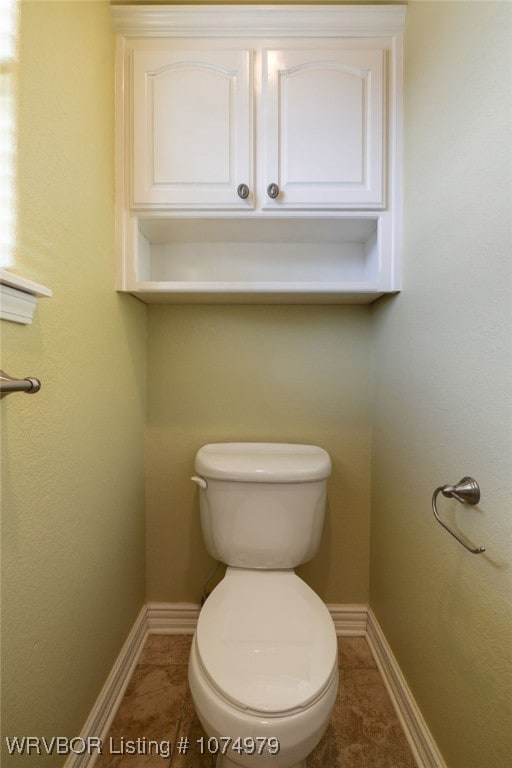 bathroom featuring tile patterned flooring and toilet